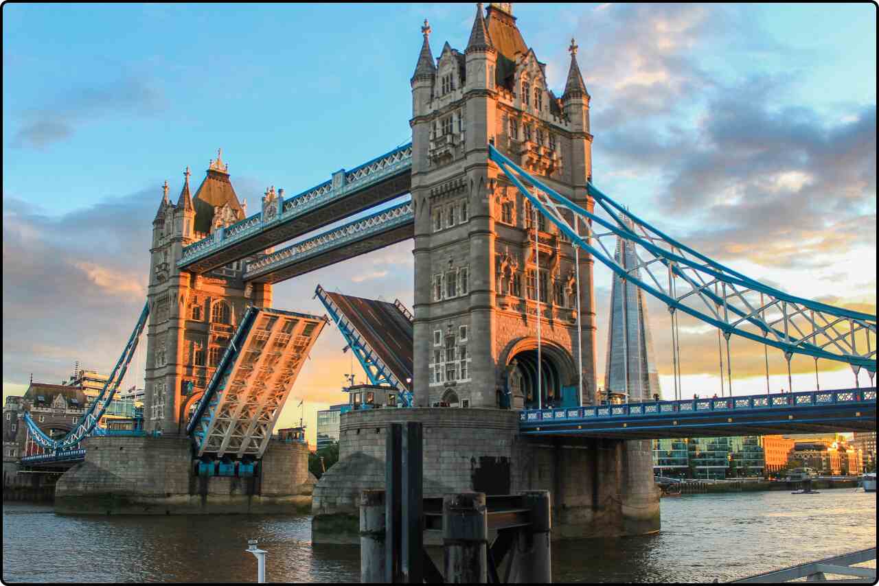 Tower Bridge in London, spanning the River Thames with its iconic twin towers.